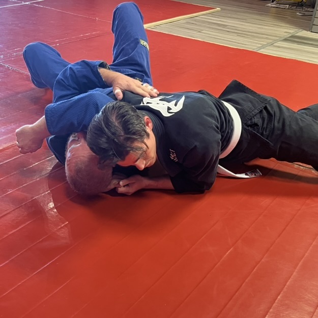Dom training Brazilian Jiu Jitsu with with sparing partner.